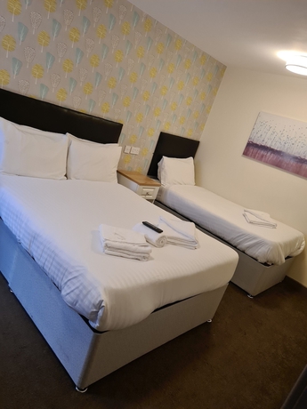 Imagen de la habitación del Hotel The Avenue Lodge. Foto 9
