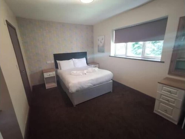 Imagen de la habitación del Hotel The Avenue Lodge. Foto 13