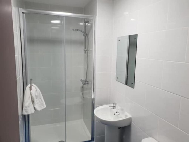 Imagen de la habitación del Hotel The Avenue Lodge. Foto 16