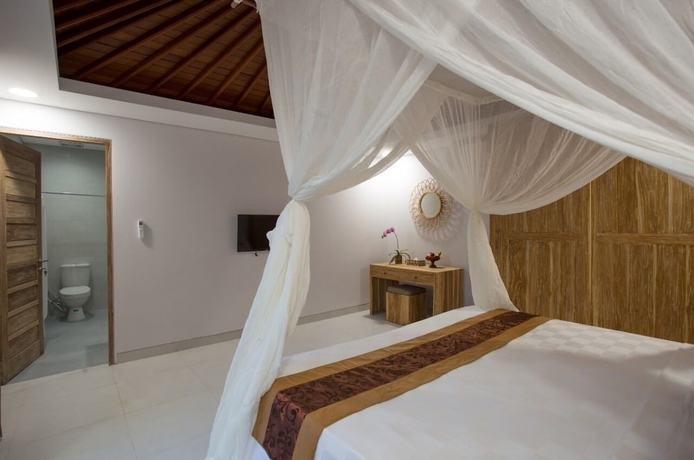 Imagen de la habitación del Hotel The Awandari Villas Seminyak. Foto 13