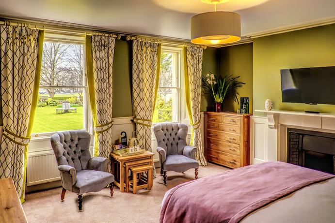 Imagen de la habitación del Hotel The Ayrlington. Foto 16