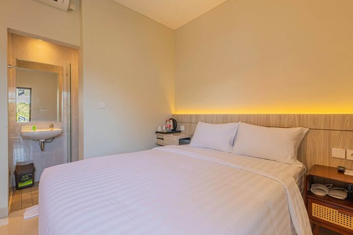 Imagen de la habitación del Hotel The Baliem. Foto 11