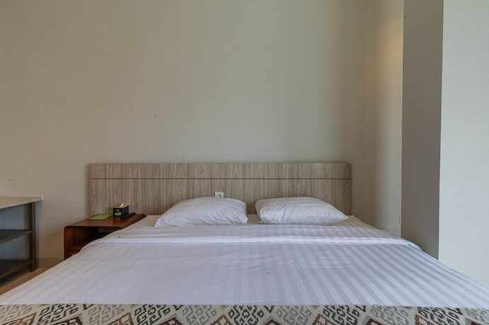 Imagen de la habitación del Hotel The Baliem. Foto 16