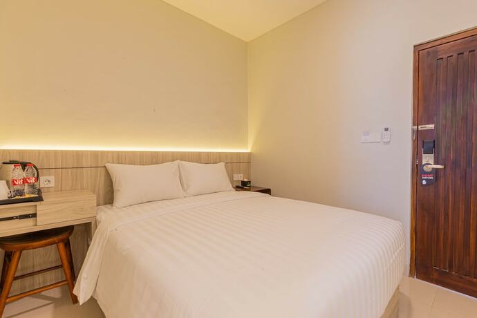 Imagen de la habitación del Hotel The Baliem. Foto 17