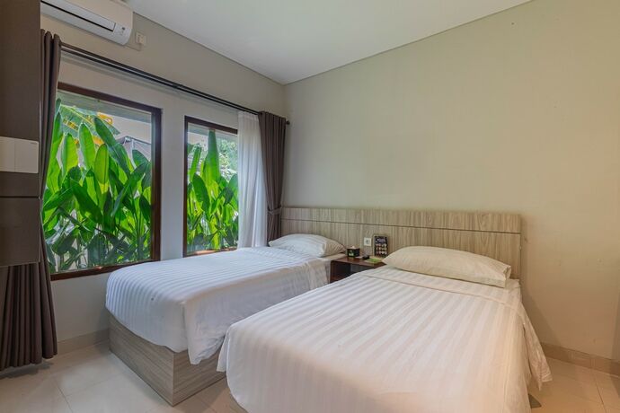 Imagen de la habitación del Hotel The Baliem. Foto 19