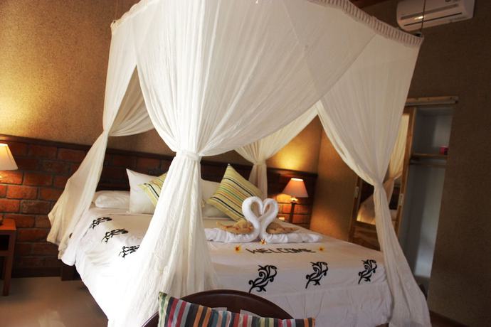 Imagen de la habitación del Hotel The Banyan Menjangan. Foto 3