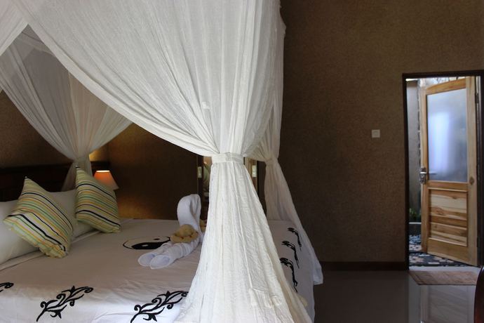 Imagen de la habitación del Hotel The Banyan Menjangan. Foto 4