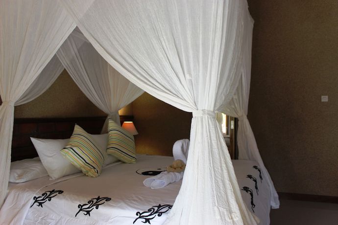 Imagen de la habitación del Hotel The Banyan Menjangan. Foto 5