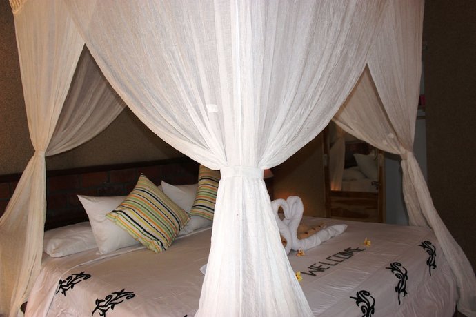 Imagen de la habitación del Hotel The Banyan Menjangan. Foto 6