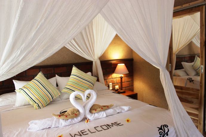 Imagen de la habitación del Hotel The Banyan Menjangan. Foto 7
