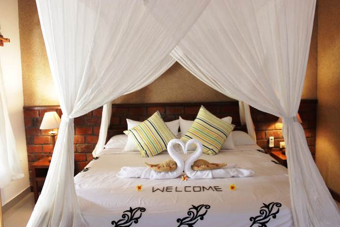 Imagen de la habitación del Hotel The Banyan Menjangan. Foto 9