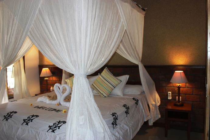 Imagen de la habitación del Hotel The Banyan Menjangan. Foto 10