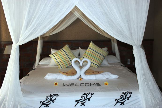 Imagen de la habitación del Hotel The Banyan Menjangan. Foto 11