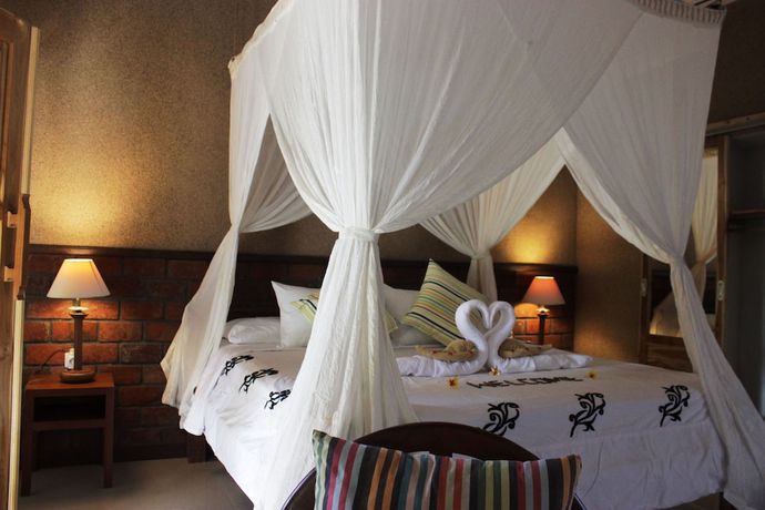 Imagen de la habitación del Hotel The Banyan Menjangan. Foto 12