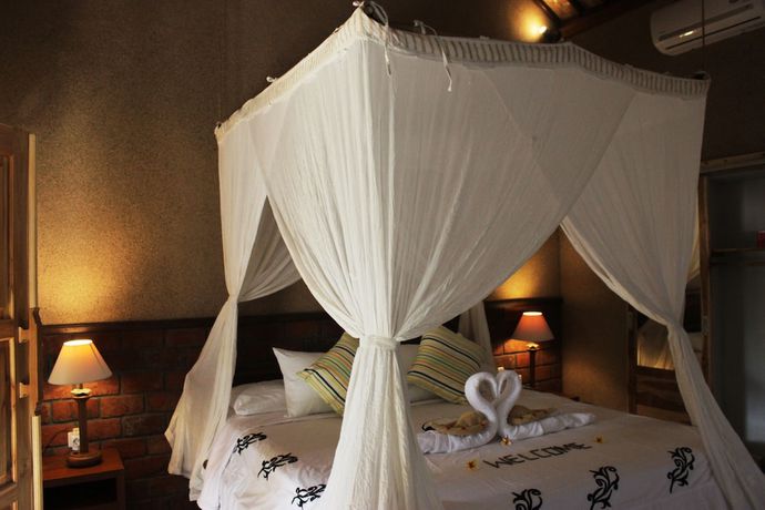 Imagen de la habitación del Hotel The Banyan Menjangan. Foto 13