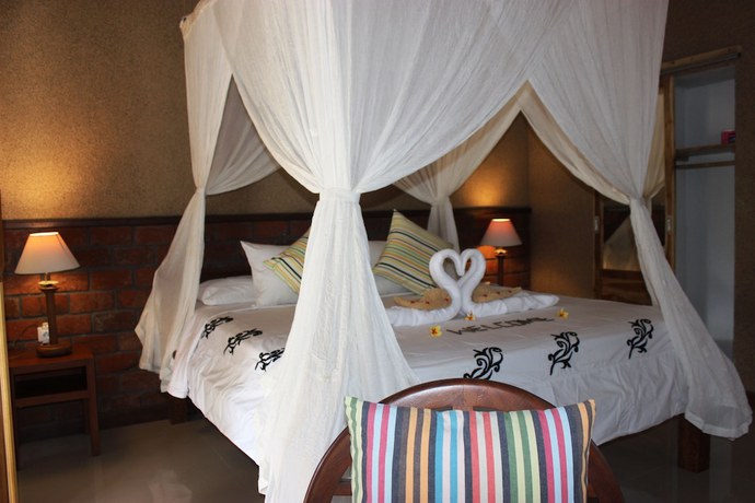 Imagen de la habitación del Hotel The Banyan Menjangan. Foto 14
