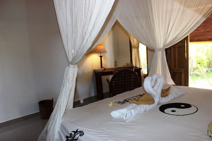 Imagen de la habitación del Hotel The Banyan Menjangan. Foto 15