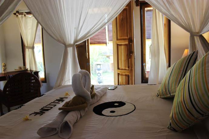 Imagen de la habitación del Hotel The Banyan Menjangan. Foto 18
