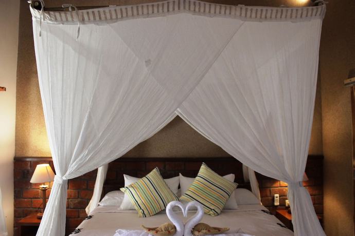 Imagen de la habitación del Hotel The Banyan Menjangan. Foto 19