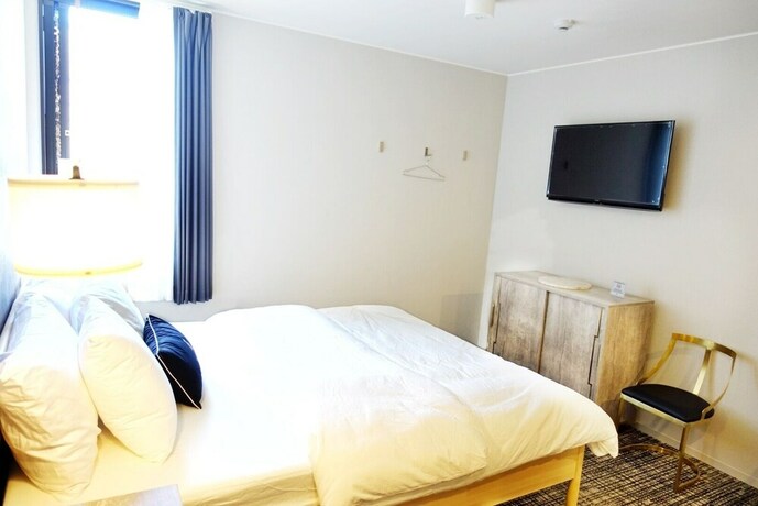 Imagen de la habitación del Hotel The Barn Tokyo. Foto 29