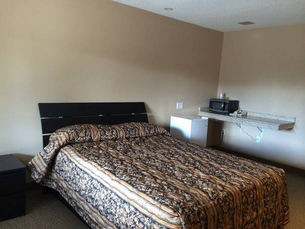 Imagen de la habitación del Hotel The Barrie Motel. Foto 7