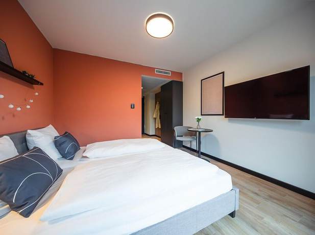 Imagen de la habitación del Hotel The Base Munich. Foto 4