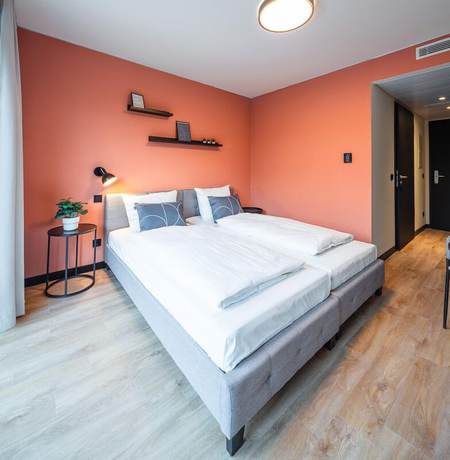 Imagen de la habitación del Hotel The Base Munich. Foto 6