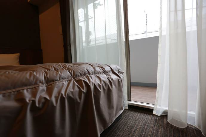 Imagen de la habitación del Hotel The Base Sakaihigashi Apartment. Foto 13