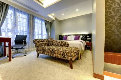 Imagen de la habitación del Hotel The Bauhinia Central. Foto 3