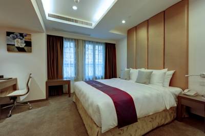 Imagen de la habitación del Hotel The Bauhinia Central. Foto 5