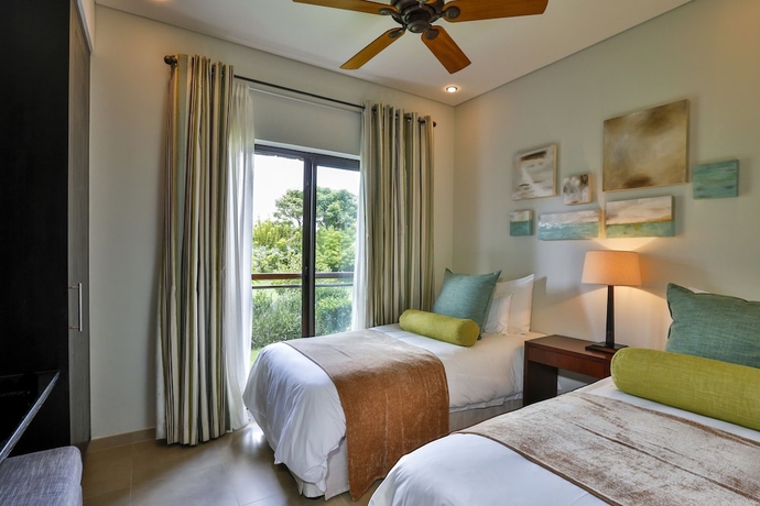 Imagen de la habitación del Hotel The Bay Club at Anahita. Foto 12