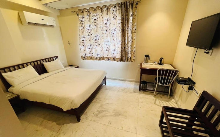 Imagen de la habitación del Hotel The Bayan Elegance. Foto 7