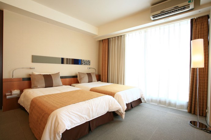 Imagen de la habitación del Hotel The Beach Tower Okinawa. Foto 4