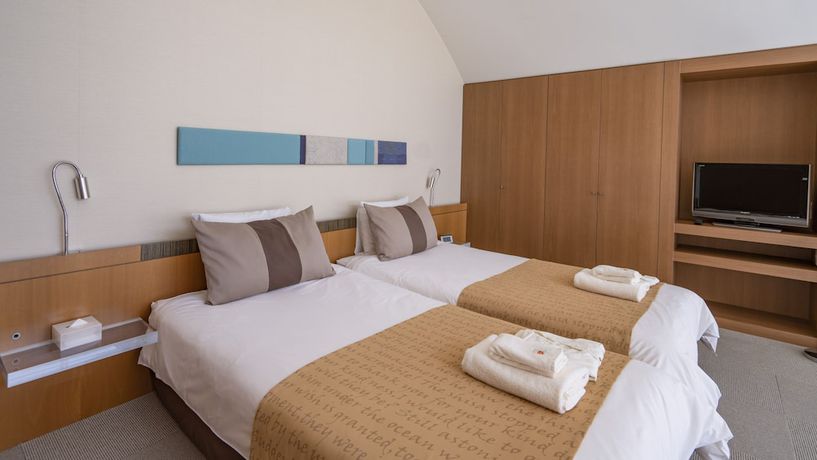 Imagen de la habitación del Hotel The Beach Tower Okinawa. Foto 12