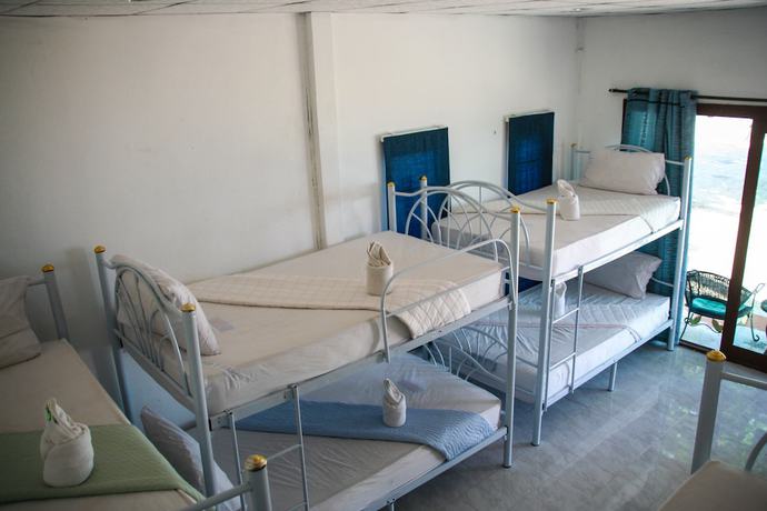 Imagen de la habitación del Hotel The Beach Village - Hostel. Foto 11