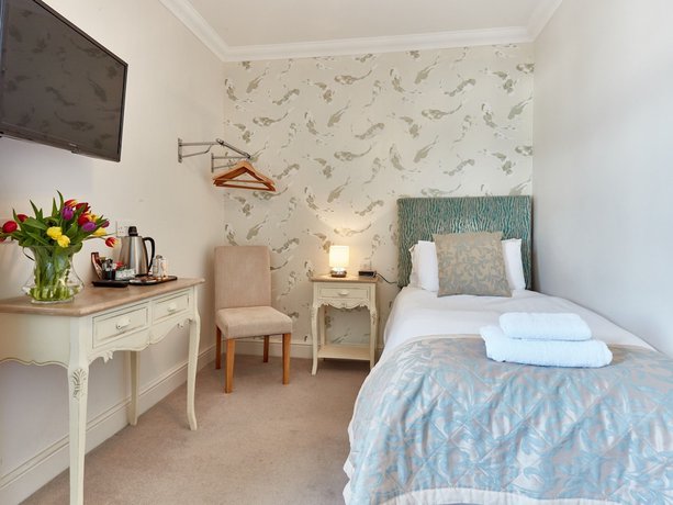 Imagen de la habitación del Hotel The Beaches Guest House. Foto 8
