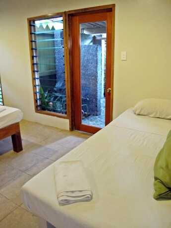 Imagen de la habitación del Hotel The Beachouse. Foto 17