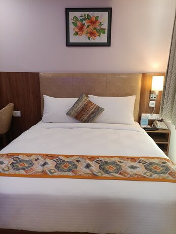 Imagen de la habitación del Hotel The Beacon Vadodara. Foto 16