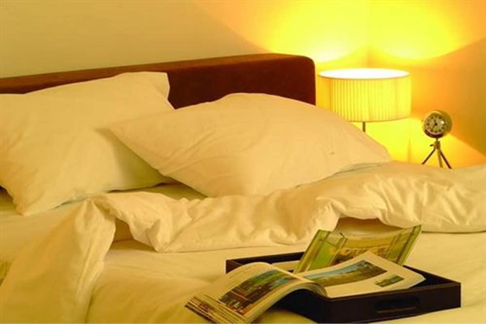 Imagen de la habitación del Hotel The Bedrooms Boutique. Foto 16