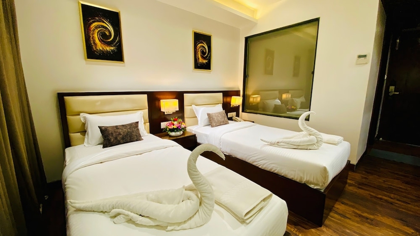 Imagen de la habitación del Hotel The Bellevue, Indore. Foto 3