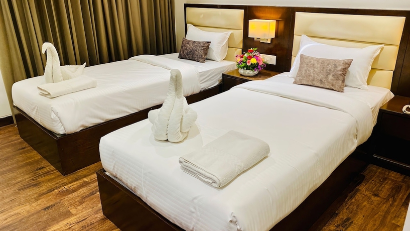 Imagen de la habitación del Hotel The Bellevue, Indore. Foto 4