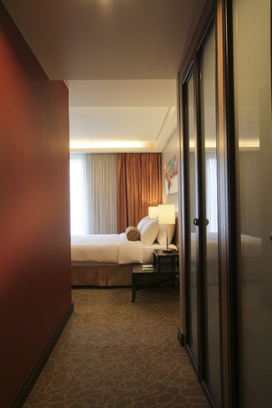 Imagen de la habitación del Hotel The Bellevue Manila. Foto 3