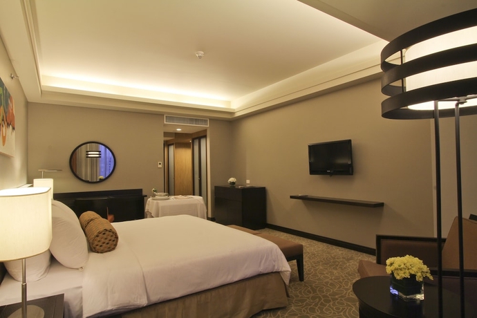 Imagen de la habitación del Hotel The Bellevue Manila. Foto 7