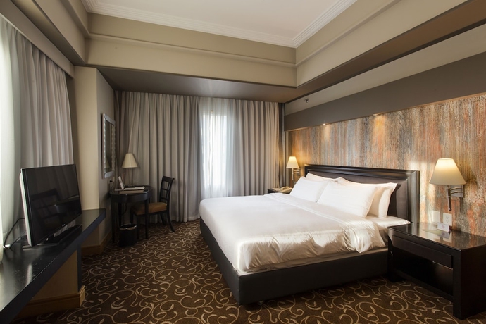 Imagen de la habitación del Hotel The Bellevue Manila. Foto 11