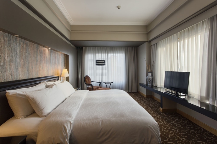 Imagen de la habitación del Hotel The Bellevue Manila. Foto 12