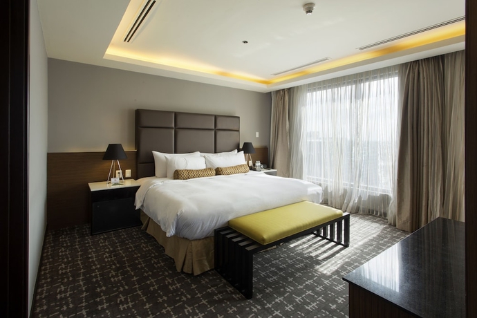 Imagen de la habitación del Hotel The Bellevue Manila. Foto 15