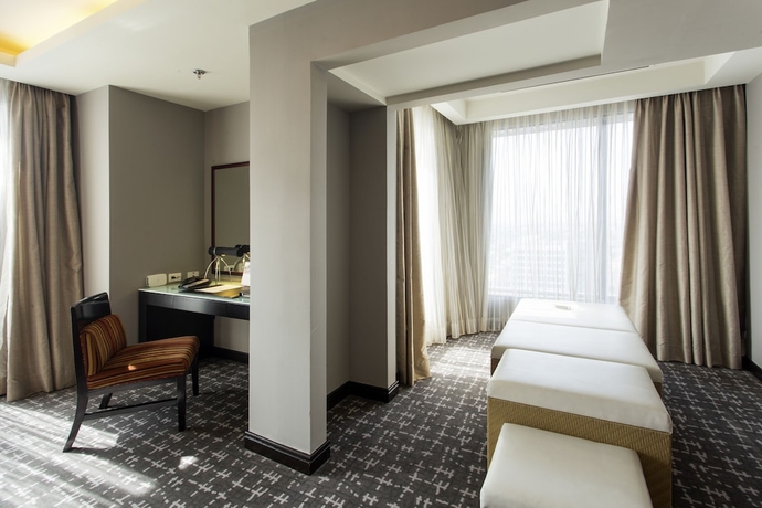Imagen de la habitación del Hotel The Bellevue Manila. Foto 16