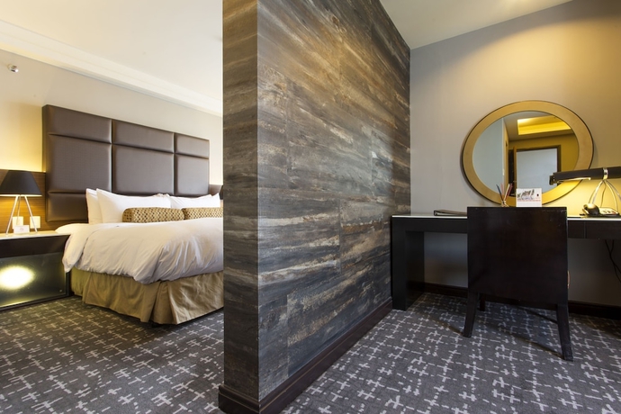 Imagen de la habitación del Hotel The Bellevue Manila. Foto 17