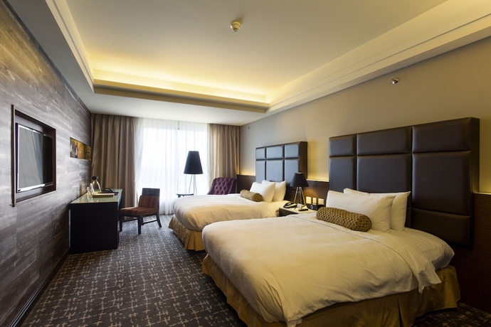 Imagen de la habitación del Hotel The Bellevue Manila. Foto 18