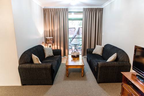 Imagen de la habitación del Hotel The Belmore Apartments. Foto 2